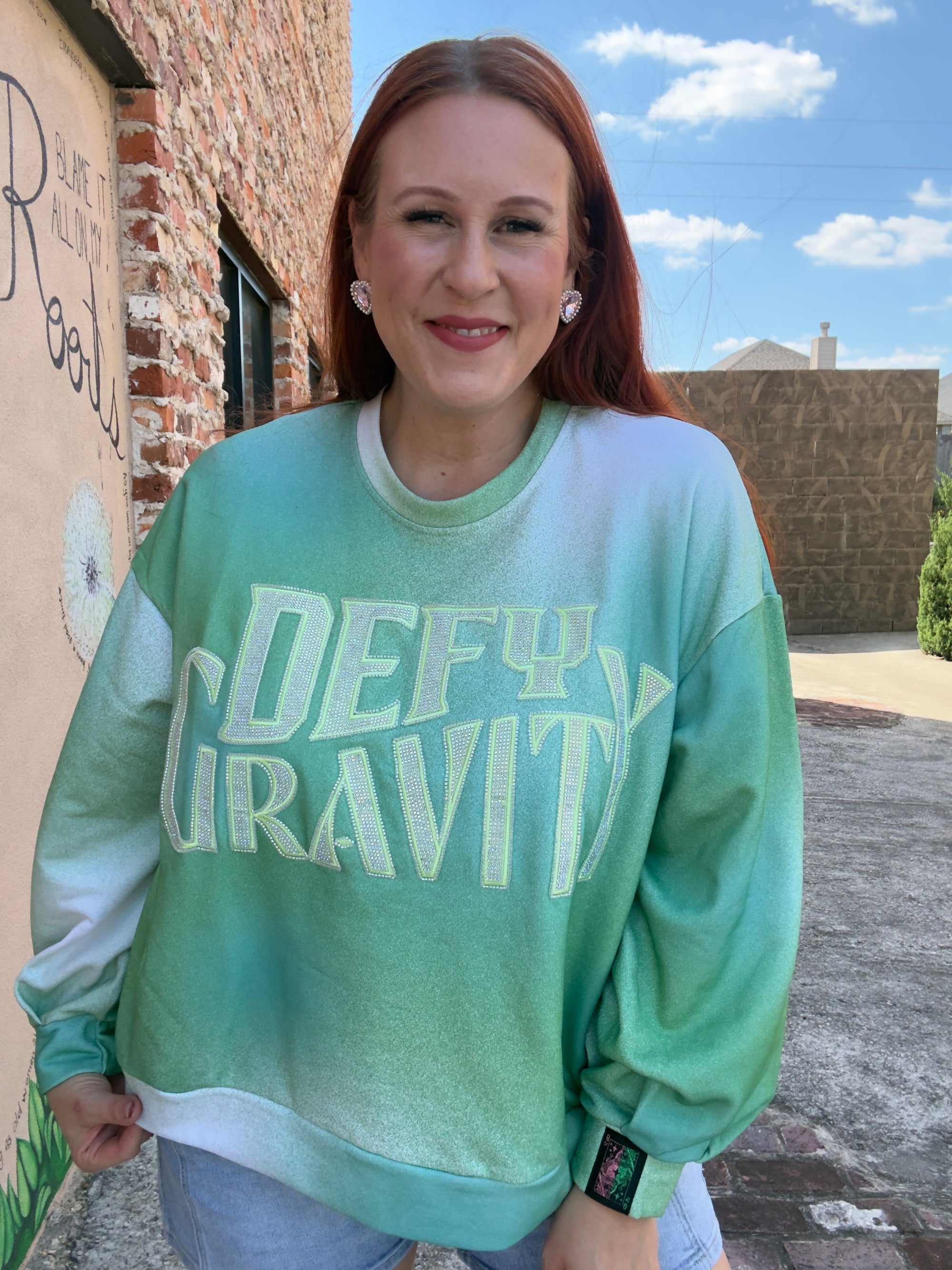 Queen of Sparkles Licensed 'Defy Gravity' Sweatshirt
