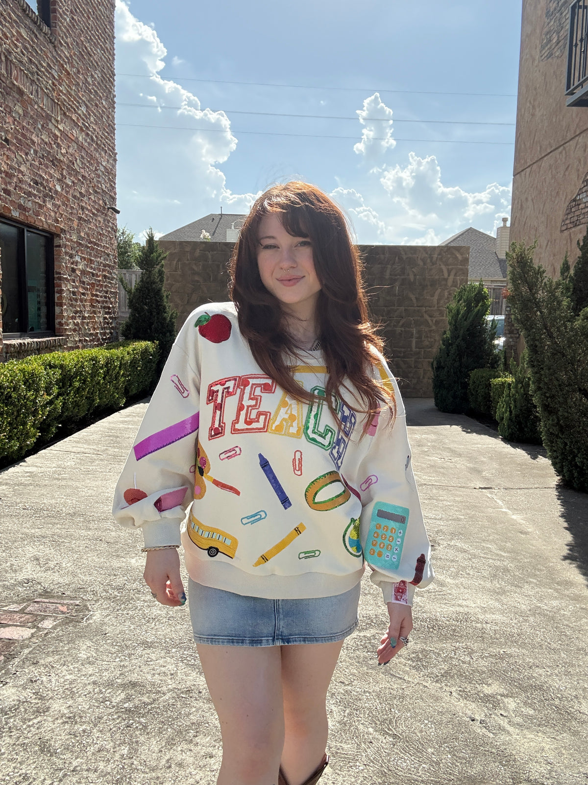 Queen of Sparkles Beige Multi 'Teach' Scattered Icon Sweatshirt