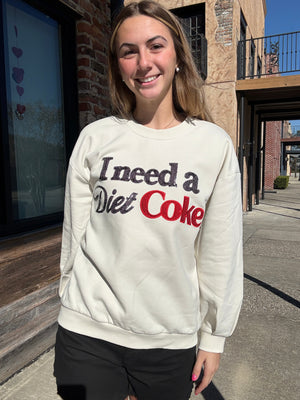 Queen of Sparkles Licensed Beige 'I Need A Diet Coke' Sweatshirt