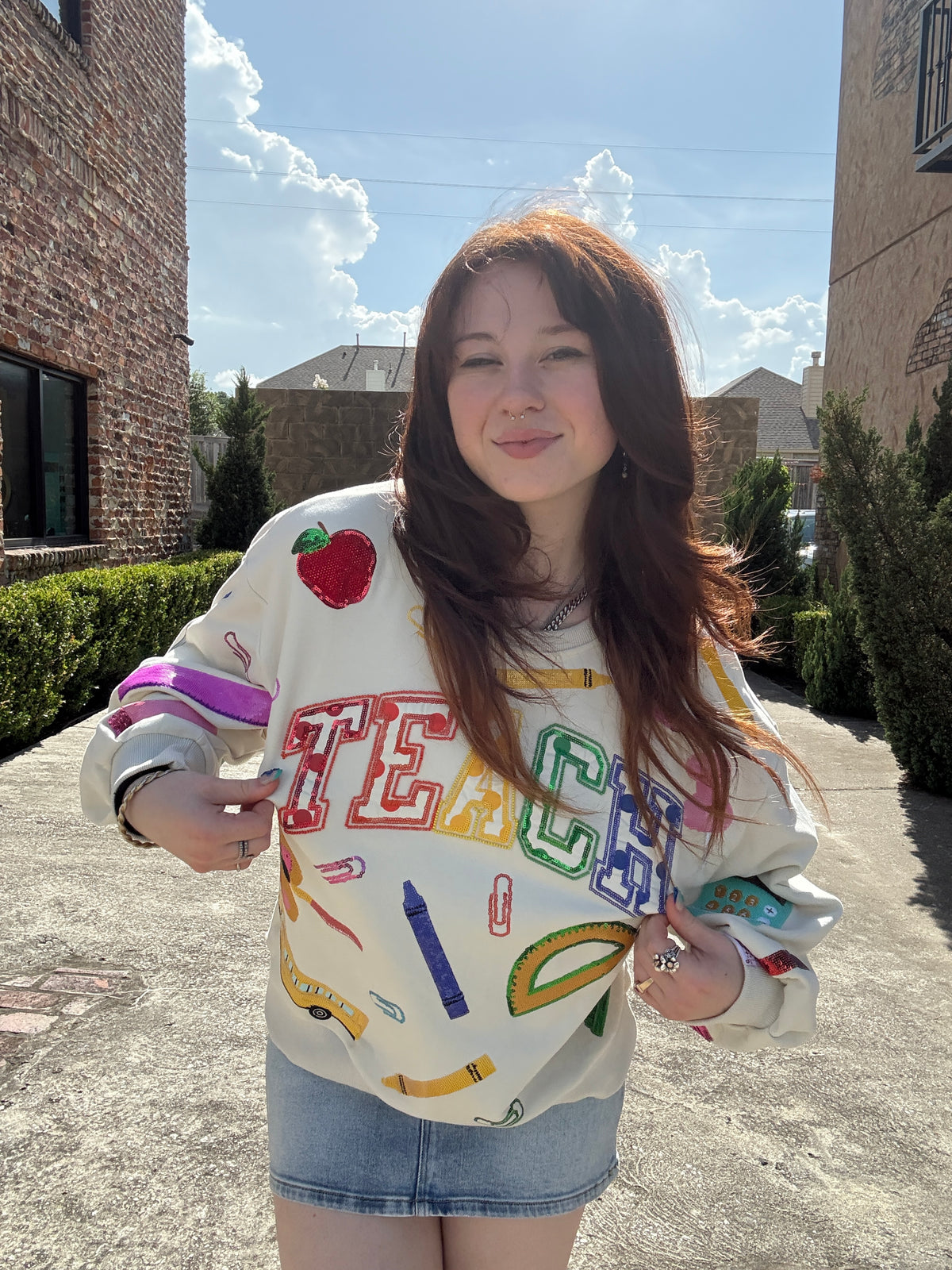 Queen of Sparkles Beige Multi 'Teach' Scattered Icon Sweatshirt