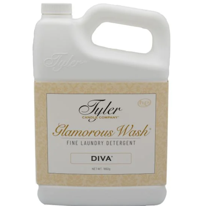 A white plastic jug of Tyler Candle Company Glamorous Wash Fine Laundry Detergent in the DIVA scent, featuring a beige patterned label.